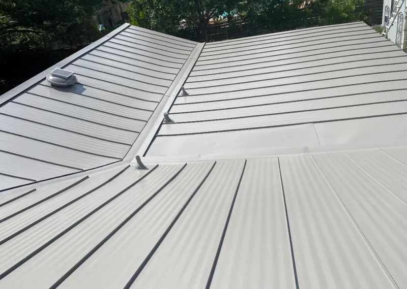 Solar attic fan installed on a metal roof for Roof Ventilation in View Park-Windsor Hills